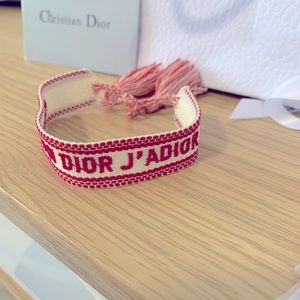 J’ADIOR White and Red cotton bracelet.